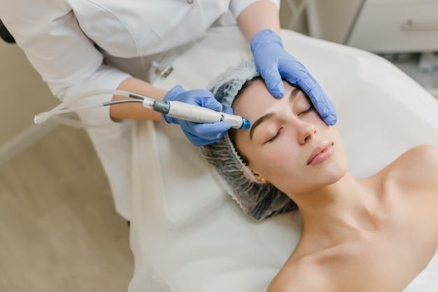 1620892999 view from rejuvenation beautiful woman enjoying cosmetology procedures beauty salon dermatology hands blue glows healthcare therapy botox 197531 2783