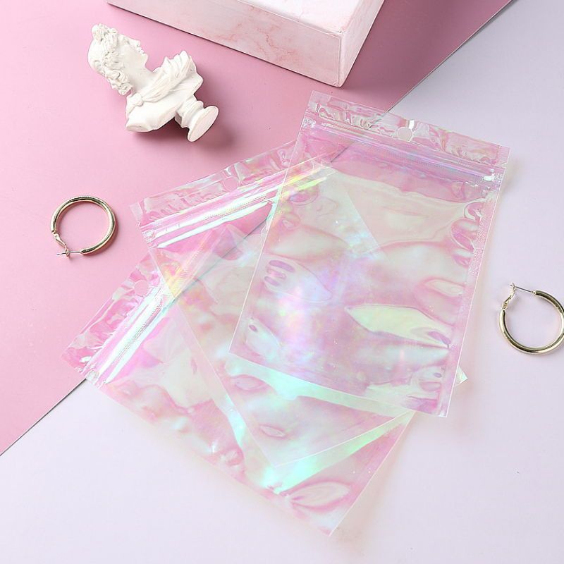 1693228423 100pcs clear pink holographic zipper packaging bag flat pouches small laser zip lock plastic bags for