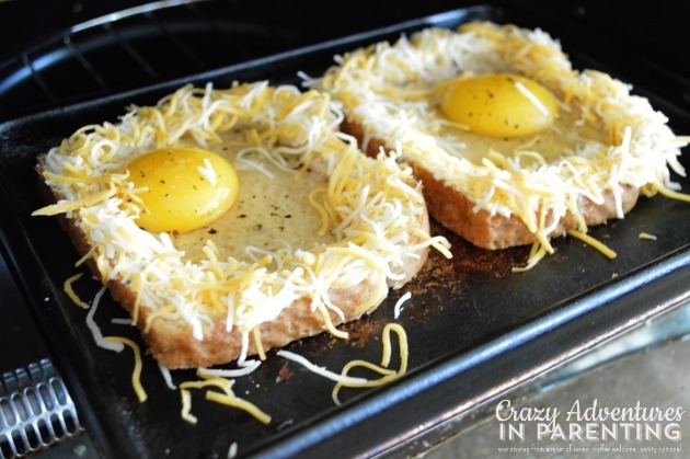1435142727 putting cheesy baked egg toast in toaster