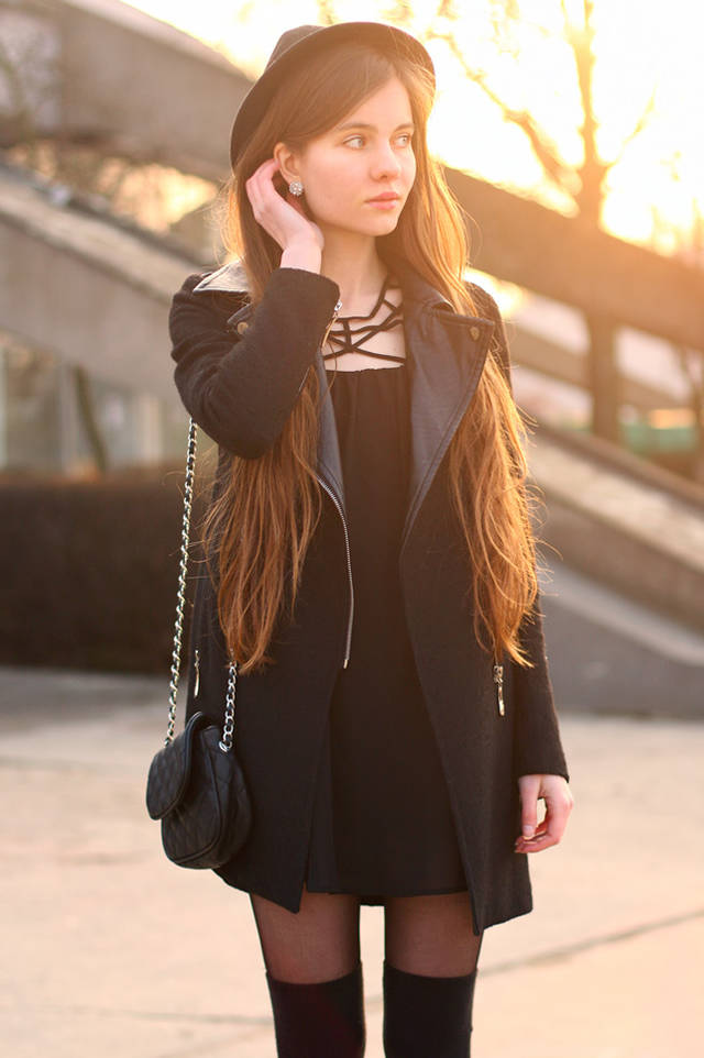 1463725379 simple black dress with a black coat and knee high socks.