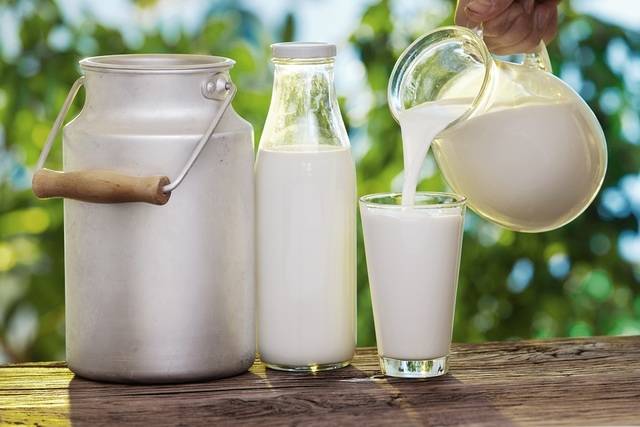 1435637620 pouring fresh raw milk in glass