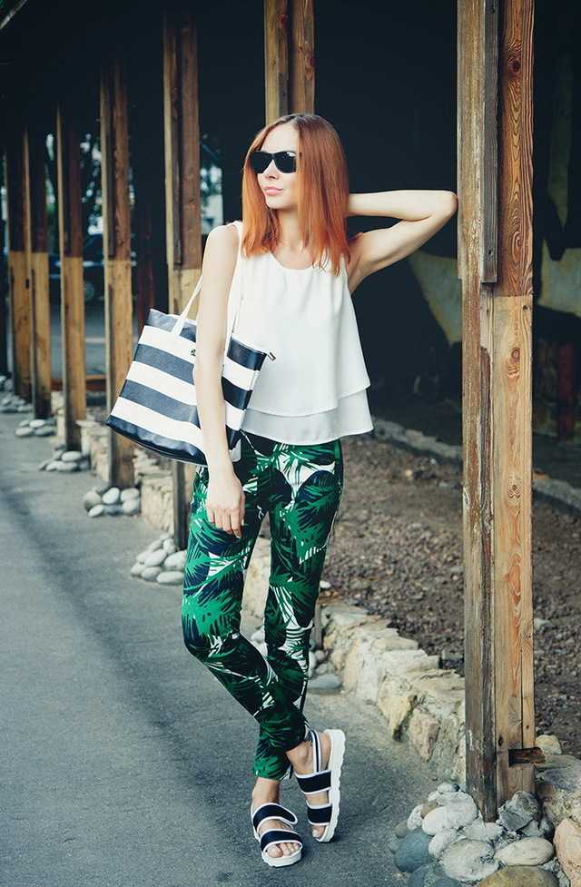 1466841247 4. palm print pants with white top and metallic slip ons