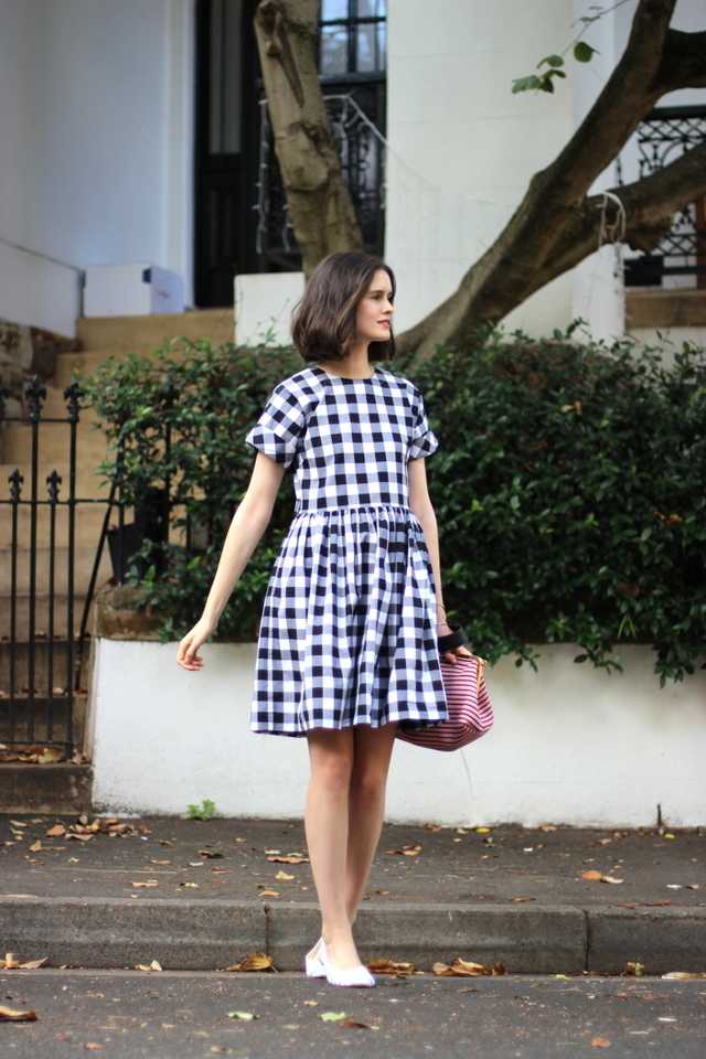 1466870469 bcyhill chloe hill wearing antipodium london hatchet dress in black gingham check with miu miu pink stripe bag and repetto paris striped ballet flats