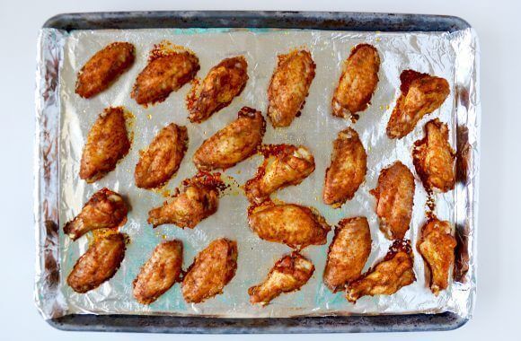 1467267457 baked moroccan chicken wings photo 580x380
