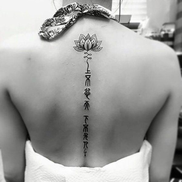 https://image.sistacafe.com/images/uploads/content_image/image/164625/1469167791-Lotus-and-fonts-spine-tattoo-24.jpg