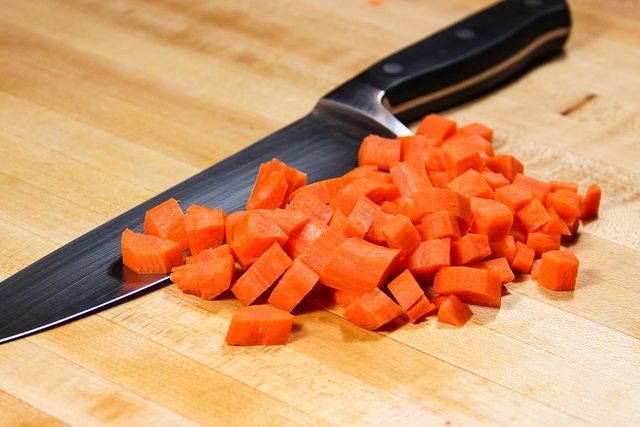 1469446871 diced carrots with chefs knife