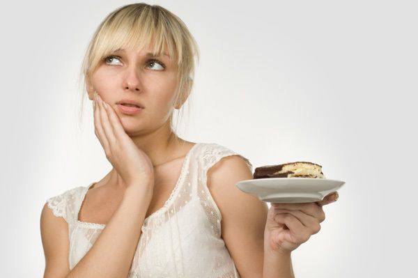 1470847815 woman eating cake