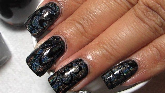 https://image.sistacafe.com/images/uploads/content_image/image/181919/1471186117-Black-And-Holographic-Water-Marble-Nail-Art-Design.jpg