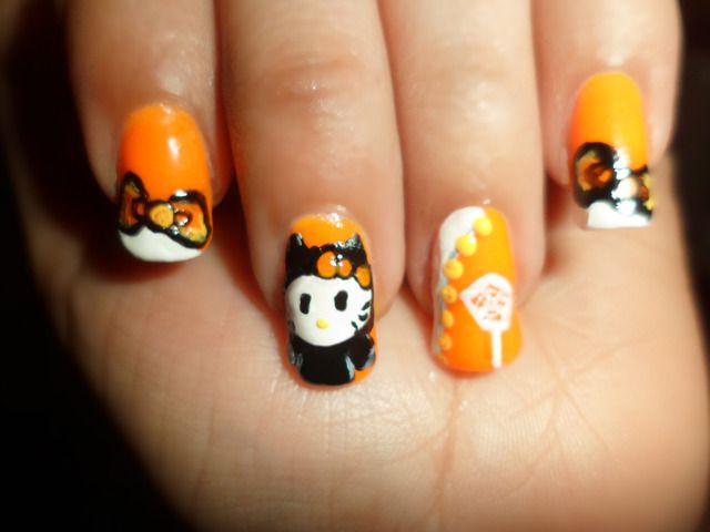 https://image.sistacafe.com/images/uploads/content_image/image/191098/1472098172-Cheap-Black-and-Yellow-Hello-Kitty-Halloween-Nail-Design-on-Tumblr.jpg