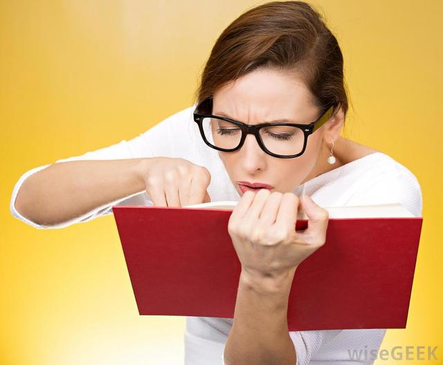 1485329284 woman in glasses holding red book