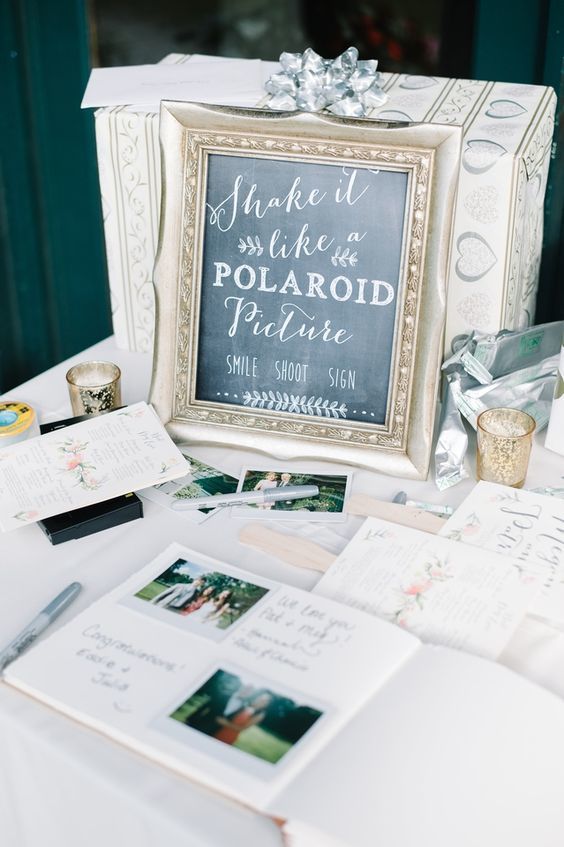1489553227 polaroid wedding guest book and table