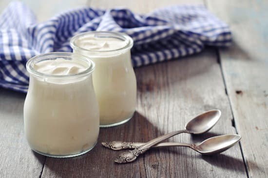 1491204055 jars of yogurt on a wooden table