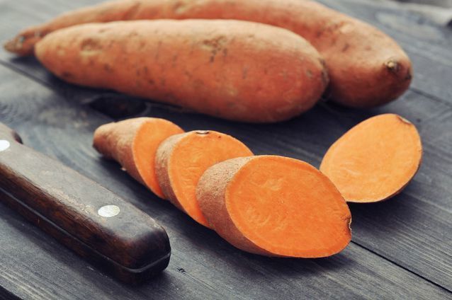 1498194974 raw sliced sweet potatoes wooden table knife.jpg.638x0 q80 crop smart