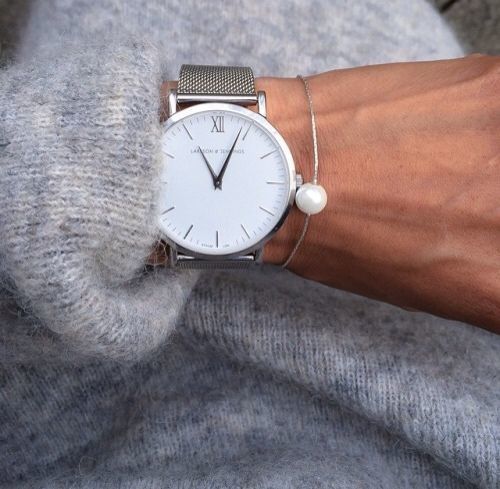1503618073 16 a minimalist watch on a silver band with a silver pearl bracelet for a modern or minimalist outfit