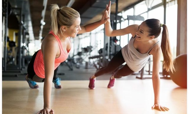1505349912 adobestock 123802422 friends workout fitness buddy women hi five 660x400