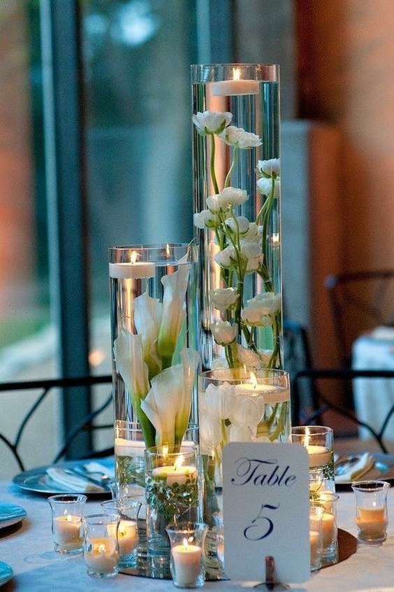 1507270787 white candles wedding centerpiece