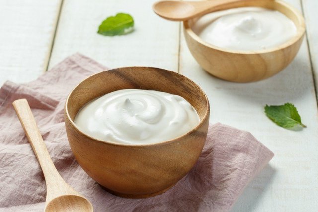 1509298519 homemade yogurt or sour cream in a wooden bowl