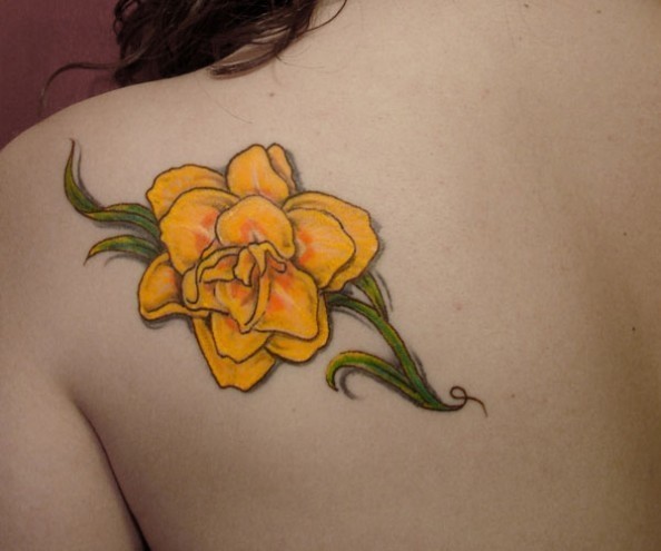 1509376125 this bright yellow daffodil tattoo is a lovely way to remember a deceased loved one or to remember a friend or place 594x495