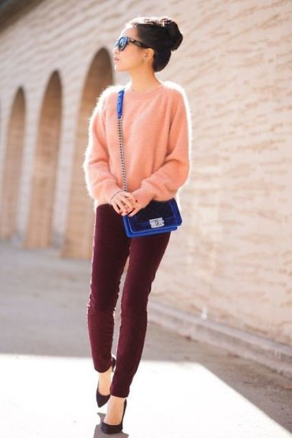 1511098330 10 burgundy velvet pants and a peach colored angora sweater black heels and an electric blue bag