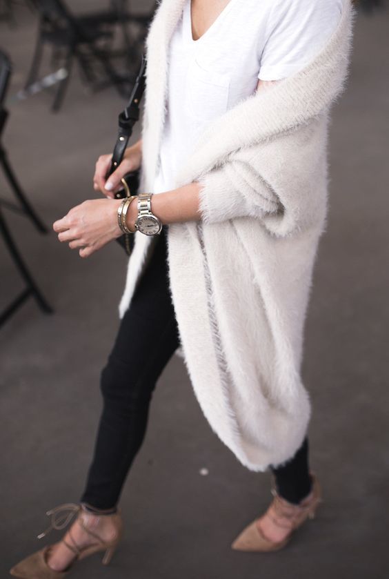 1511098434 14 black jeans a white tee lace up shoes and a white long angora cardigan