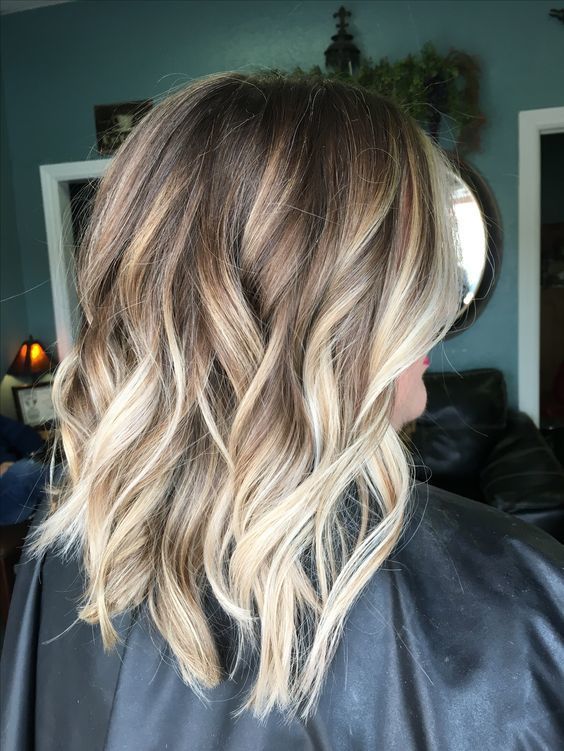 1516759546 07 light brown wavy and layered hair with blonde balayage looks chic and fun