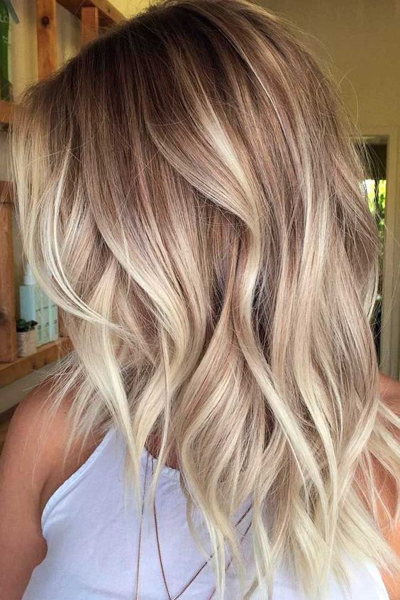 1516762601 10 blonde balayage on wavy layered chestnut hair is a cute and girlish idea