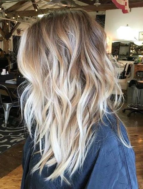 1516762679 13 light wavy layered bronde hair with blonde balayage for a highlight