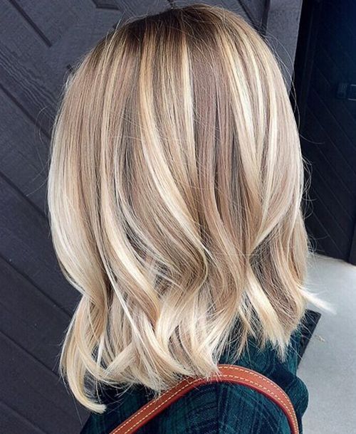 1516762750 16 wavy bronde hair with lots of blonde balayage to look bold and cool