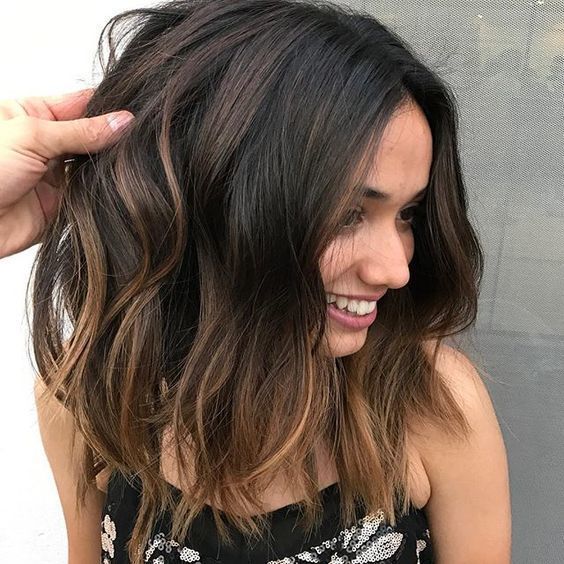 1516763768 08 dark hair with subtle bronde balayage and messy waves is one of the hottest trends