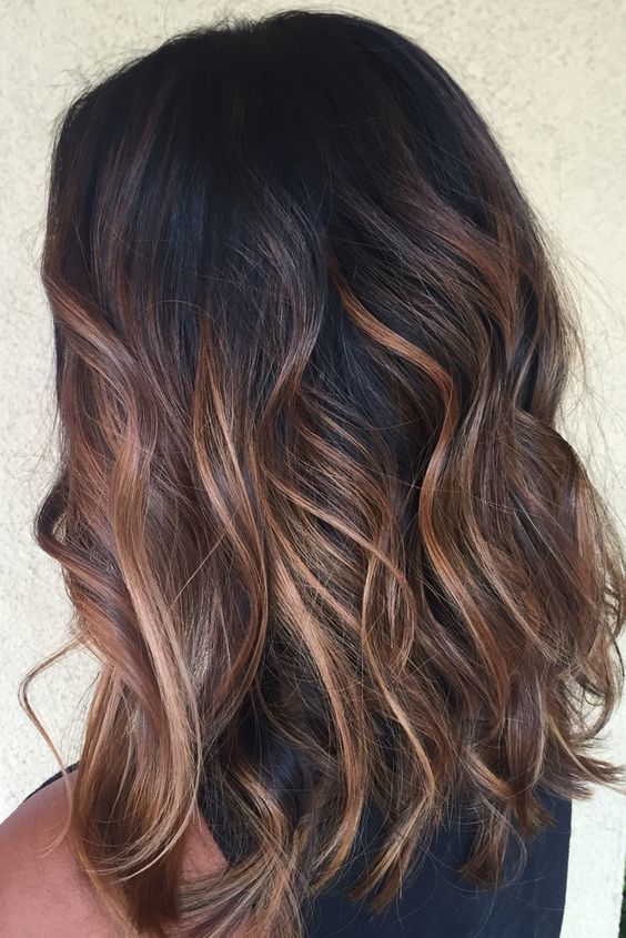 1516763806 10 black hair with red and caramel balayage to add a warm touch and chic