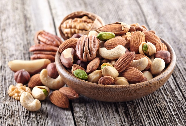 1518410927 mixed20nuts20in20a20bowl20on20a20wooden20background