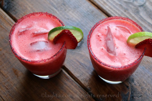 1522383474 7 garnish the strawberry margaritas with lime and strawberry slices 600x400