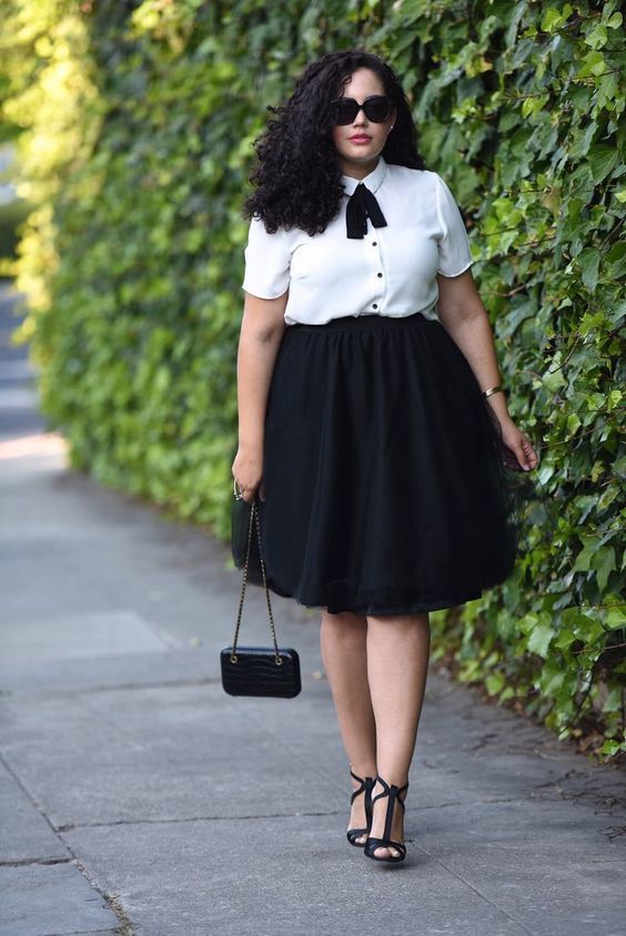 1523595530 14 a black full skirt a white blouse with black buttons and a bow and black shoes