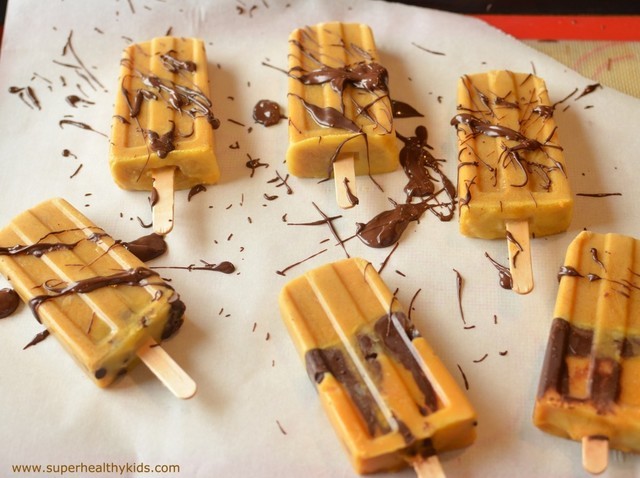 1523805850 drizzling chocolate on pumpkin pops 1024x764