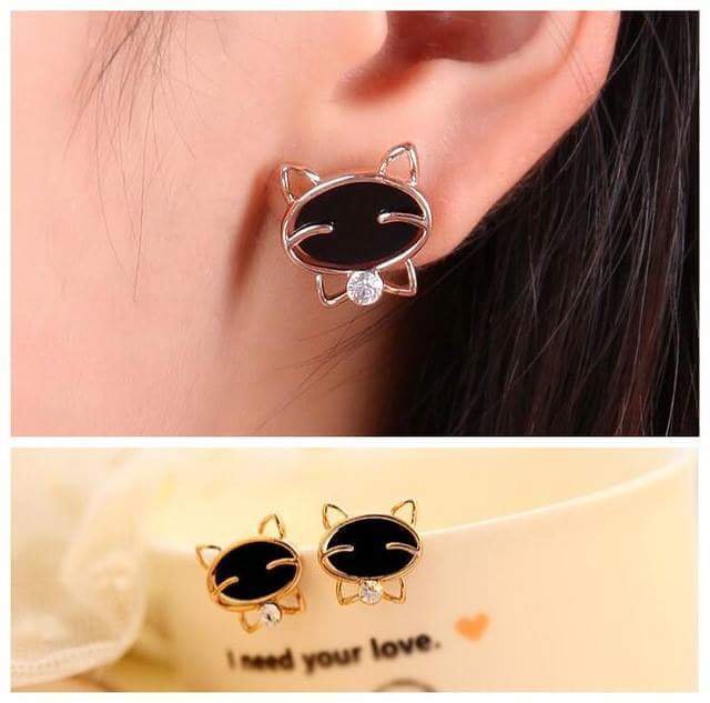 1524024441 golden stud earring design with black and small white stones