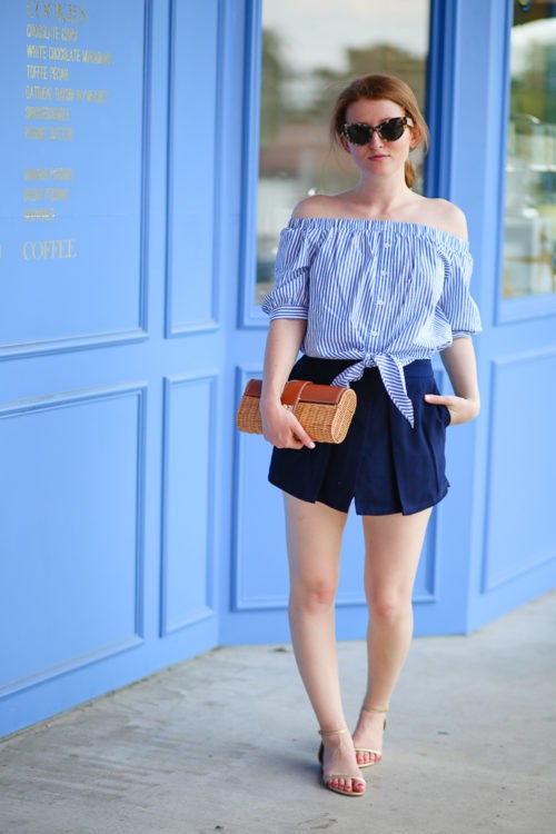 1527825290 design darling wears a striped off the shoulder top from tuckernuck navy shorts by cupcakes cashmere a wicker clutch from j.mclaughlin and pineapple sandals from lilly pulitzer 500x750