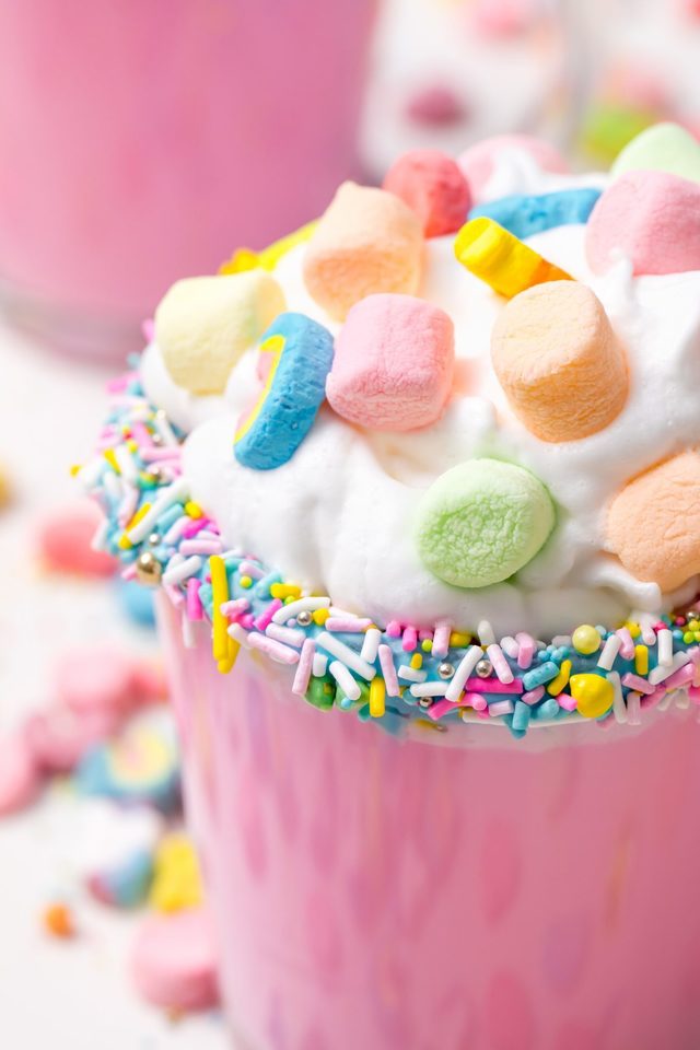 1549007519 5d4b3122 unicorn hot chocolate pink hot chocolate with whipping cream lucky charms marshmellows on a white table 1200x1800