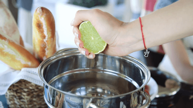 1552632739 female chef squeezes the lime juice to the pan s bptdhv  f0000