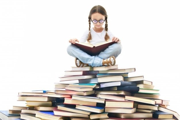 1569422118 concentrated girl surrounded by books 1098 2136