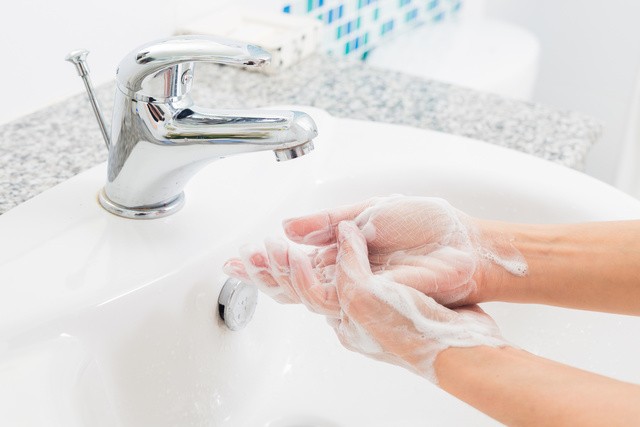 1580346762 washing hands over sink