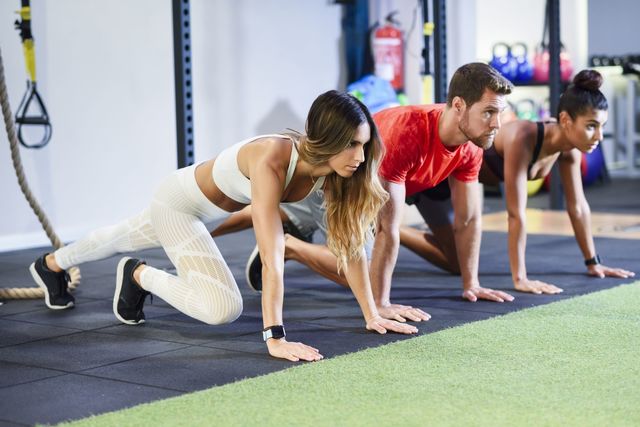 1587461252 young people exercising plank variations in a gym royalty free image 1570144775
