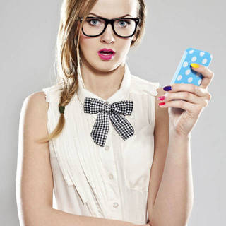 1449134693 1439352486 woman glasses holding smartphone main
