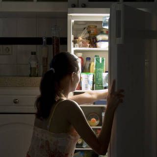 1471250126 1437629776 woman eating late night fridge