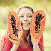 Icon 1466045054 young woman smiling with papaya