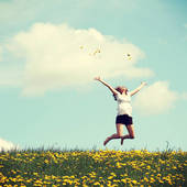Icon 1436761106 bigstock happy woman jumping on blossom 59295572