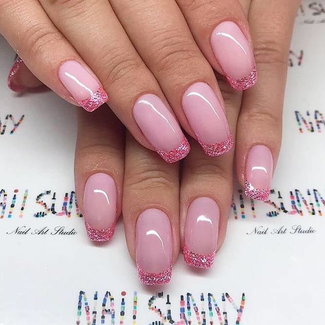 Elegant french manicure designs medium length squoval nails light pink base sparkly tips