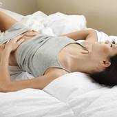 Icon 1444719951 womanlyingdownholdingstomach 850x567