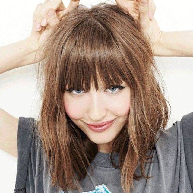 1451792359 medium wavy hairstyle with bangs 1