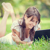 Icon 1460349950 girl with laptop in a park
